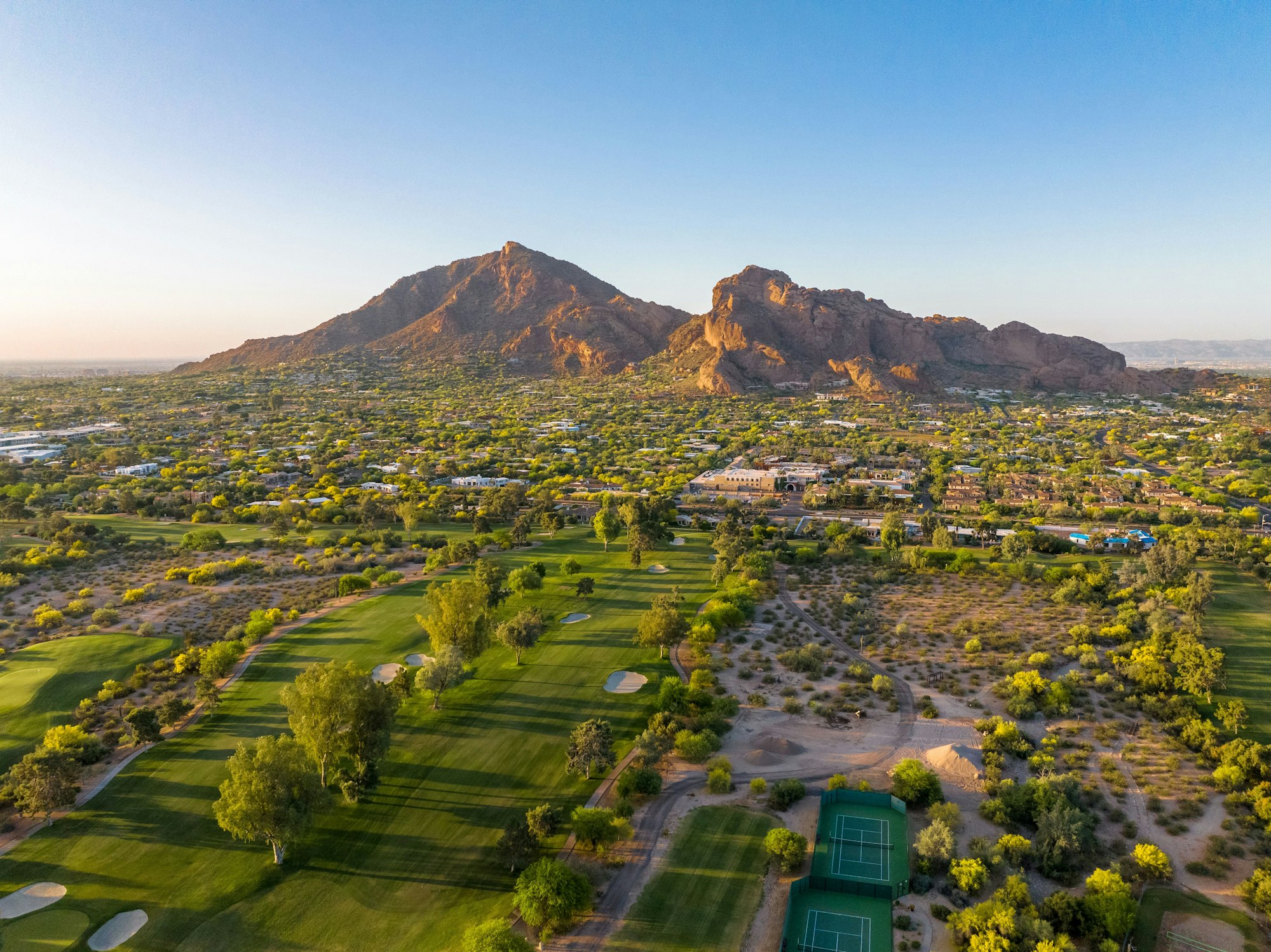 Camelback Mountain at sunrise in Phoenix, Arizona golf course and luxury homes